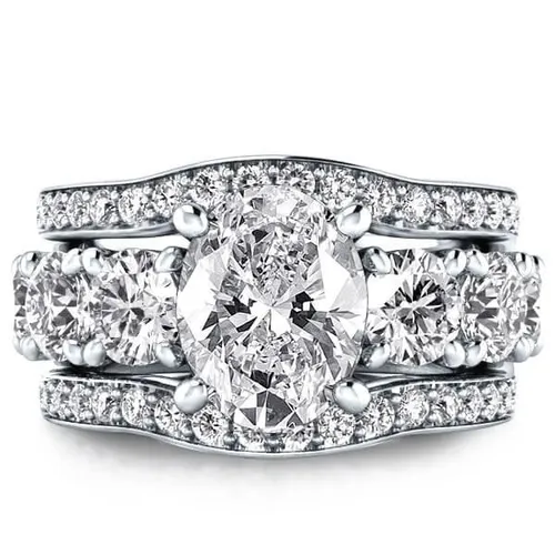 Seven Stone Oval 3PC Wedding Set (3.90 CT. TW.)
